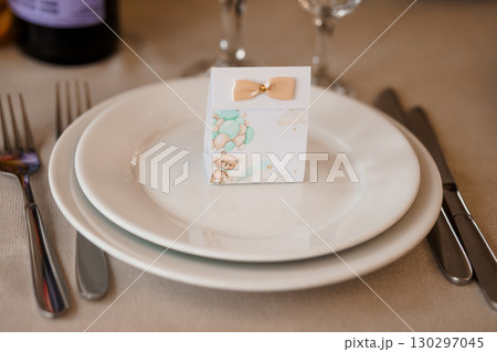 Baby Shower Favor Box with Teddy Bear and Balloon, Pastel Colors, Elegant Table Setting, Wedding, Party Decoration, Soft Focus, Cute Theme. 130297045