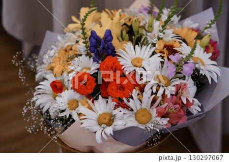 Vibrant Mixed Flower Bouquet Arrangement with Sunflowers, Daisies, Roses, Lilacs, and Baby's Breath, Colorful Floral Gift. Vibrant Mixed Flower Bouquet Arrangement with Sunflowers, Daisies, Roses, Lilacs, and Baby's Breath, Colorful Floral Gift. 130297067