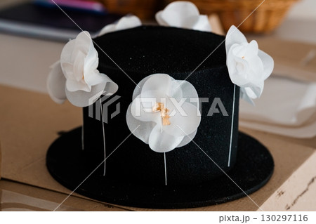 Black Velvet Box with White Camellia Flowers and Gold Accents. Close-up Still Life Photography, Elegant Wedding Decoration, Floral Arrangement Black Velvet Box with White Camellia Flowers and Gold Accents. Close-up Still Life Photography, Elegant Wedding Decoration, Floral Arrangement 130297116
