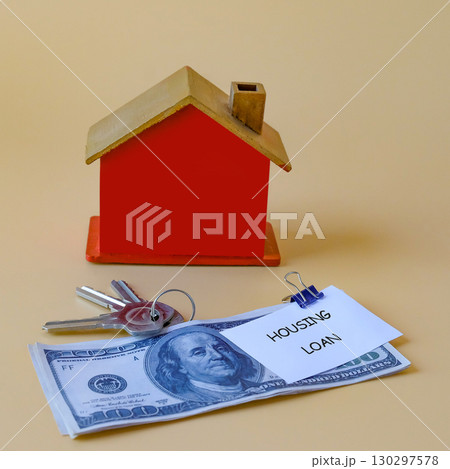 Housing loan text write on paper note and over on dollars,Finance and business concept. Housing loan text write on paper note and over on dollars,Finance and business concept. 130297578