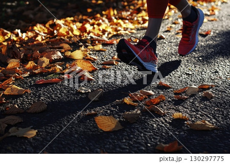 Runners Feet Pounding the Pavement Among Autumn Leaves Runners Feet Pounding the Pavement Among Autumn Leaves 130297775