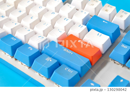 Computer keyboard on blue background. Top view 130298042