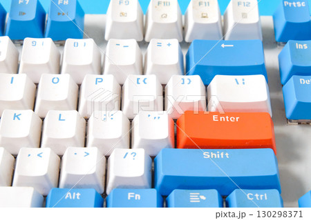 Computer keyboard on blue background. Top view Computer keyboard on blue background. Top view 130298371