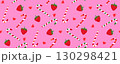 Seamless pattern of strawberries, festive candy canes, and cute small hearts, a playful, sweet, and cheerful theme on a pink background. Seasonal holiday design for Valentines day or Christmas 130298421