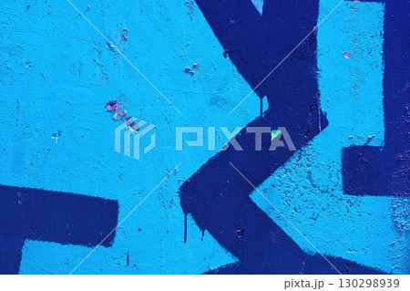 Bold Blue Graffiti with Geometric Shapes on Textured Wall, Modern 80s Street Art Vibe Bold Blue Graffiti with Geometric Shapes on Textured Wall, Modern 80s Street Art Vibe 130298939