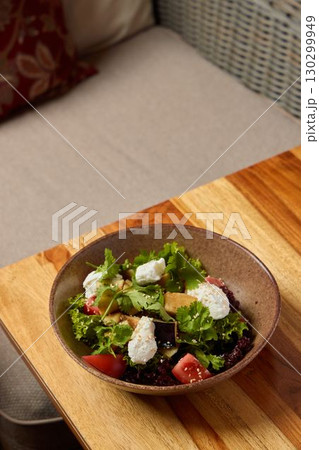 A Fresh and Vibrant Salad Featuring Crisp Greens and Juicy Tomatoes for a Delicious Meal A Fresh and Vibrant Salad Featuring Crisp Greens and Juicy Tomatoes for a Delicious Meal 130299949