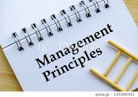 Management Principles, A professional notebook with ladder showing management principles version one concept Management Principles, A professional notebook with ladder showing management principles version one concept 130300491