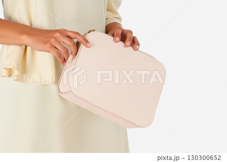 Blank pink leather cosmetic bag in hand mockup, ai generated 130300652