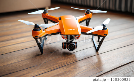 white drone on the wooden floor 130300925