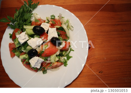 Freshly Made Mediterranean Salad on White Plate. Freshly Made Mediterranean Salad on White Plate. 130301053