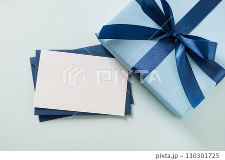 Happy Fathers Day gift box and label on blue background. View from above. 130301725