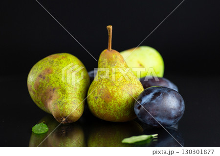 Natural fresh pears and plums in macro photography 130301877