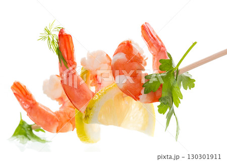 Boiled red shrimps with lemon on white background Boiled red shrimps with lemon on white background 130301911
