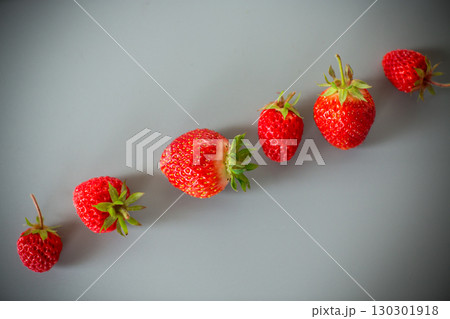 Still life with strawberries, top view on a textured background Still life with strawberries, top view on a textured background 130301918