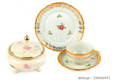 Vintage sugar bowl, tea cup, and plate with gold trim and floral patterns Vintage sugar bowl, tea cup, and plate with gold trim and floral patterns 130302071