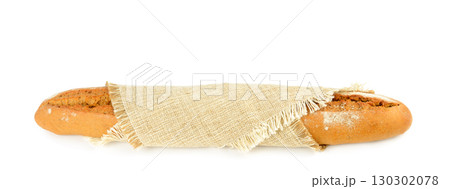 Freshly Baked Baguette Wrapped in Linen 130302078