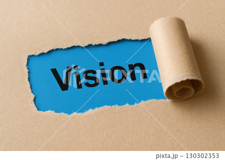 Vision word on blue background revealed through torn brown paper edge, symbolizing discovery, creativity, and inspiration in conceptual and motivational style Vision word on blue background revealed through torn brown paper edge, symbolizing discovery, creativity, and inspiration in conceptual and motivational style 130302353