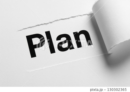 Plan paper concept idea strategy word revealed torn edge contrast closeup motivation inspiration message white black text background communication creativity design success business planning 130302365
