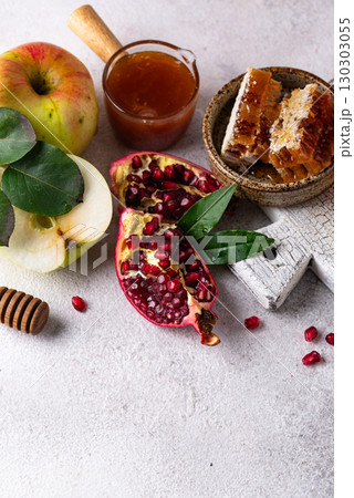 Rosh Hashana concept with honey, apple and pomegranate Rosh Hashana concept with honey, apple and pomegranate 130303055