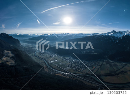 Aerial View of Alpine Valley with River and Mountains in Winter Sunlight. Pano 130303723