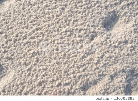 Close-up of naturally crystallized salt on the ground at the shore of a salt lake Close-up of naturally crystallized salt on the ground at the shore of a salt lake 130303893
