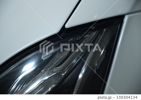 Cutting and preparing black leather or synthetic material for custom car interior 130304134