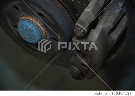 Cutting and preparing black leather or synthetic material for custom car interior 130304157