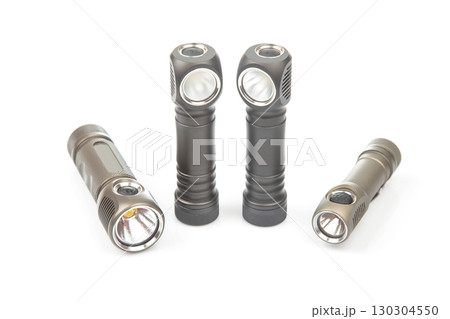 Quality flashlights arranged on a white background showcasing their design and features 130304550