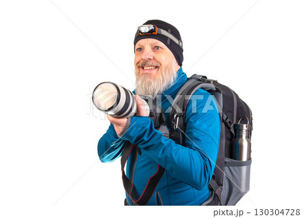 Photographer ready for adventure with camera gear and backpack in indoor setting 130304728