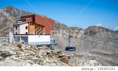 Journey high in the Swiss Alps aboard the Diavolezza cable car, offering stunning views of the Bernina range and surrounding glaciers in a breathtaking alpine setting. 130305181