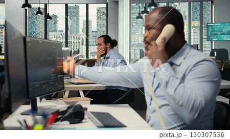 Brokerage company colleagues shocked by Black Swan event shaking global finance, making calls to withdraw money. Hedge fund coworkers see portfolio value drop from market crash Brokerage company colleagues shocked by Black Swan event shaking global finance, making calls to withdraw money. Hedge fund coworkers see portfolio value drop from market crash 130307536