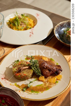 An Exquisite Gourmet Dish Featuring Chicken Accompanied by Flavorful and Colorful Garnishes An Exquisite Gourmet Dish Featuring Chicken Accompanied by Flavorful and Colorful Garnishes 130308209