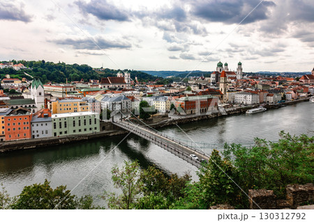 Panoramic view of Passau. Top view of suspension bridge. Aerial skyline of old town with beautiful reflection in Danube river, Bavaria, Germany. High quality photo 130312792