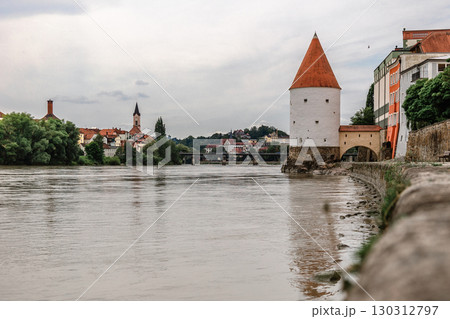 Panoramic view Schaibling Tower and promenade on river Inn, Passau, Lower Bavaria, Germany. Panoramic view Schaibling Tower and promenade on river Inn, Passau, Lower Bavaria, Germany. 130312797