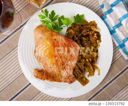 Close-up fried pork meat chops with stewed beans Close-up fried pork meat chops with stewed beans 130313792