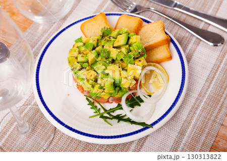 Salmon tartare with avocado and toasted bread Salmon tartare with avocado and toasted bread 130313822