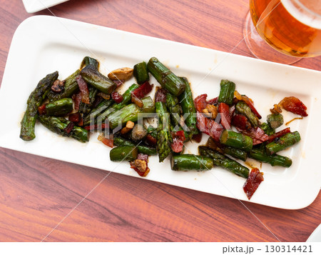 Appetizing fried asparagus with ham and foie gras Appetizing fried asparagus with ham and foie gras 130314421
