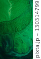 Ink fluid flow. Paint liquid. Defocused green color splash water shine sparkle creative wet texture on abstract art acrylic background. 130314799