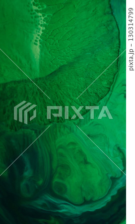 Ink fluid flow. Paint liquid. Defocused green color splash water shine sparkle creative wet texture on abstract art acrylic background. Ink fluid flow. Paint liquid. Defocused green color splash water shine sparkle creative wet texture on abstract art acrylic background. 130314799