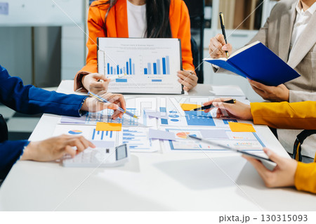Business team meeting present.professional investor working with Finance managers task. with laptop smart phone Business team meeting present.professional investor working with Finance managers task. with laptop smart phone 130315093