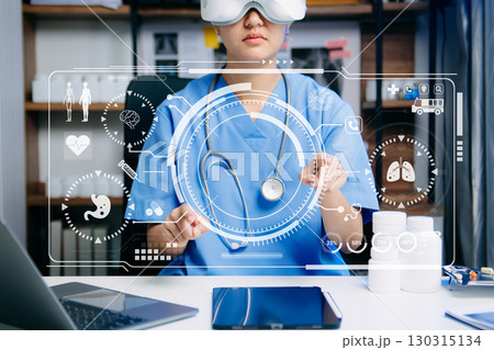 Nurse using VR and digital interface for futuristic healthcare, showcasing innovation, telemedicine, and advanced medical technology. Nurse using VR and digital interface for futuristic healthcare, showcasing innovation, telemedicine, and advanced medical technology. 130315134