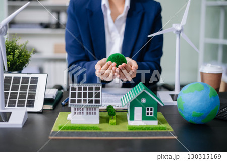 Business planning hand using laptop for working technology and business Net zero and carbon neutral concept.NET ZERO 130315169