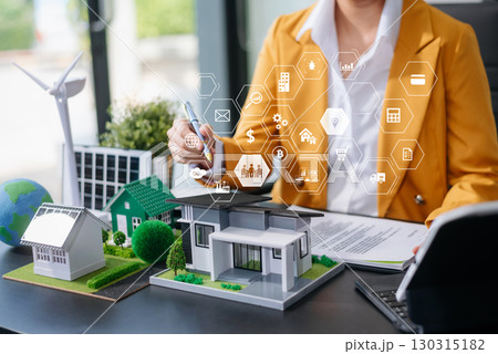 balancing the property sector The real estate agent is explaining the house style to see the house design and the purchase agreement. model house and comdo balancing the property sector The real estate agent is explaining the house style to see the house design and the purchase agreement. model house and comdo 130315182