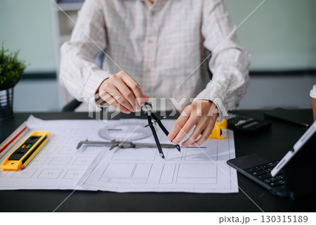 usiness people having consultation about wind energy at company office. on architectural project site and making model house. usiness people having consultation about wind energy at company office. on architectural project site and making model house. 130315189