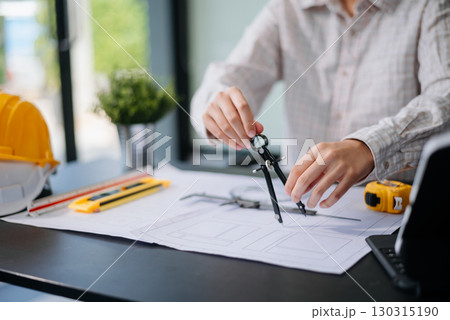 usiness people having consultation about wind energy at company office. on architectural project site and making model house. 130315190