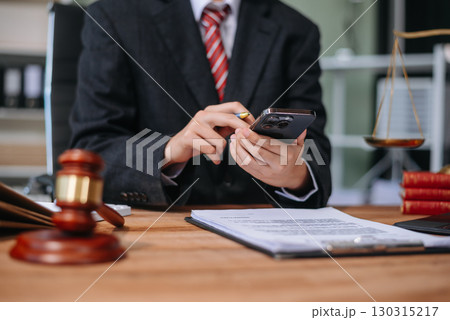 Justice and law concept.Male judge in a courtroom on white table and Counselor Justice and law concept.Male judge in a courtroom on white table and Counselor 130315217