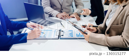 Business team collaboration discussing working analyzing with financial data and marketing growth report graph Business team collaboration discussing working analyzing with financial data and marketing growth report graph 130315277