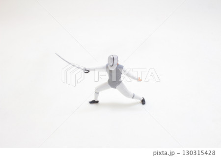 Fencer Performing a Lunge Maneuver Equipped in Protective Gear Fencer Performing a Lunge Maneuver Equipped in Protective Gear 130315428