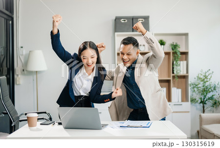 Happy businesspeople while collaborating on a new project in an office. team of diverse businesspeople using a laptop and tablet Happy businesspeople while collaborating on a new project in an office. team of diverse businesspeople using a laptop and tablet 130315619