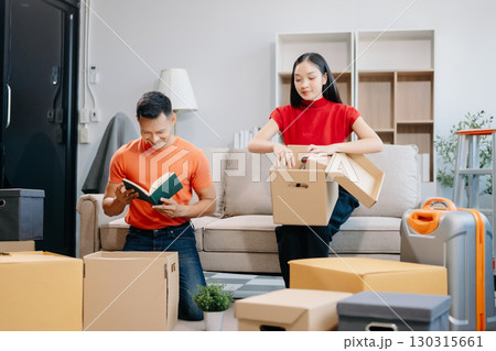 Asian young attractive couple man and woman use tablet and smartphone online shopping furniture decorate house 130315661